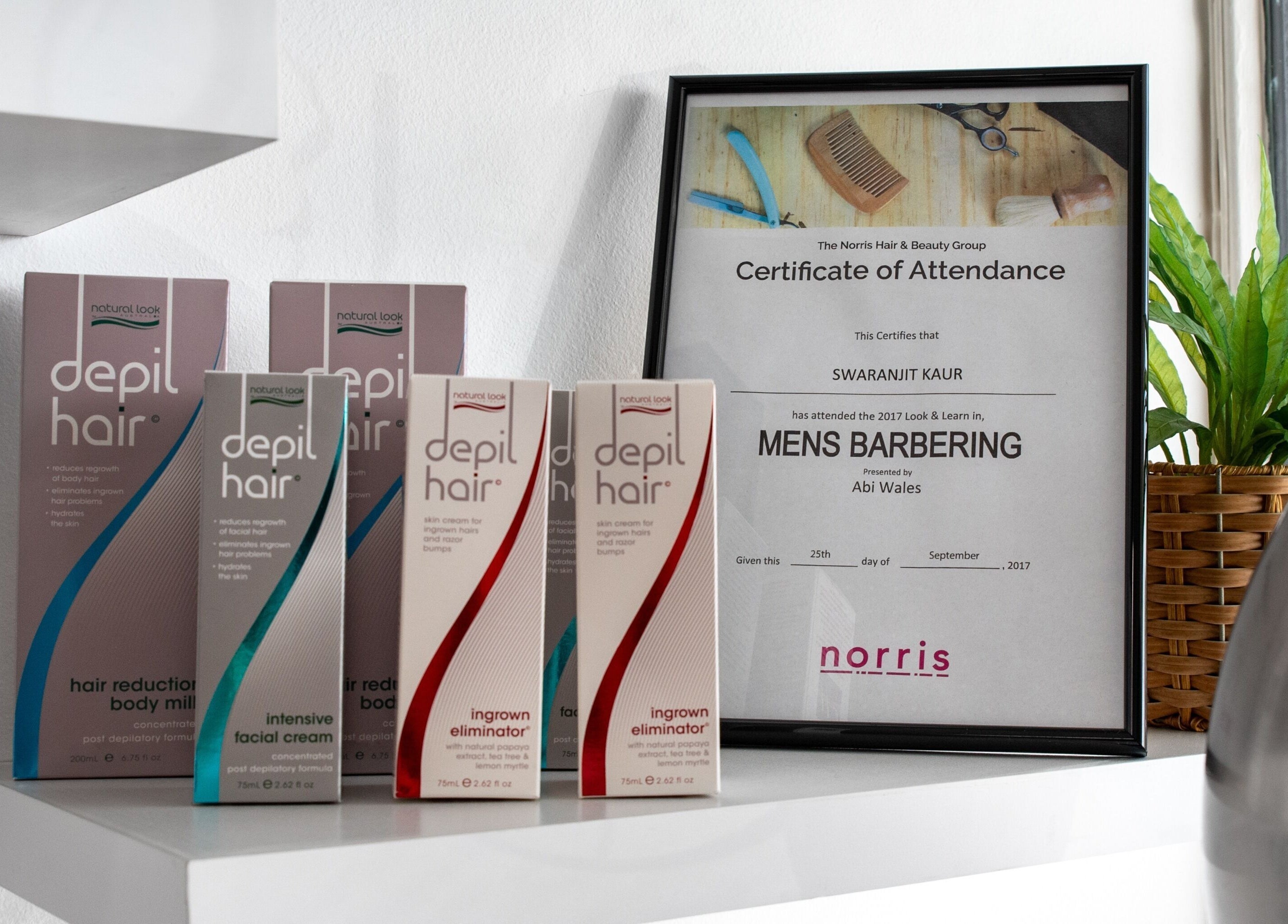 Beauty products and certificate at Adore Makeovers, Newton, South Australia, AU, showcasing elegant decor.