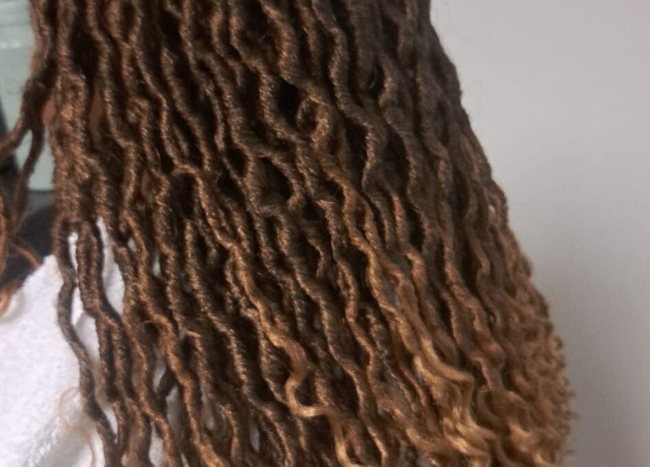 Stylish locs hairstyle at Lotus Beauty Hair in Cape Town, Western Cape, ZA. Natural look enhancing beauty.