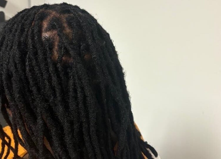 Stylish dreadlocks at Lotus Beauty Hair in Cape Town, Western Cape, ZA, showcasing expert hairstyling skills.