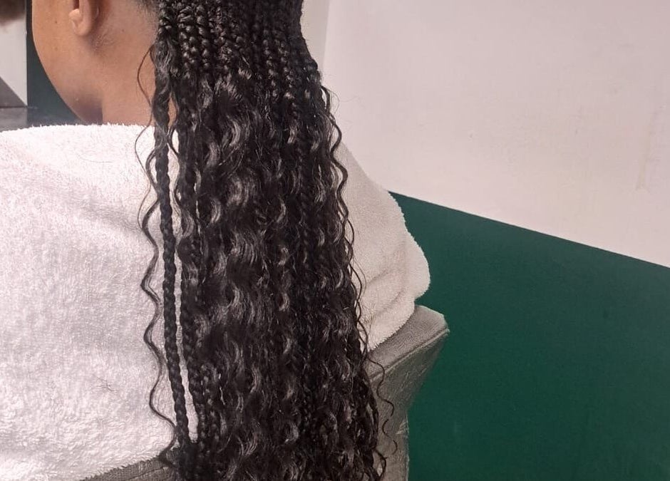 Braided hairstyle at Lotus Beauty Hair, Cape Town, Western Cape, ZA showcasing intricate work.