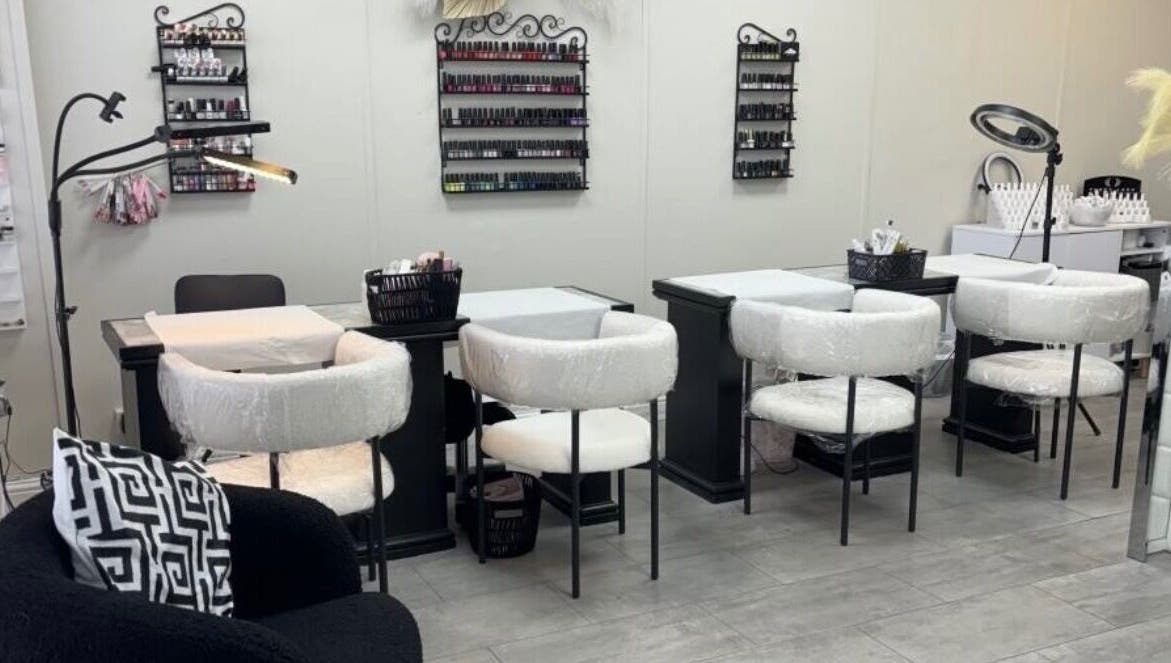 Nail salon at Tranquil, Liverpool, England, GB with elegant manicure stations and plush seating.
