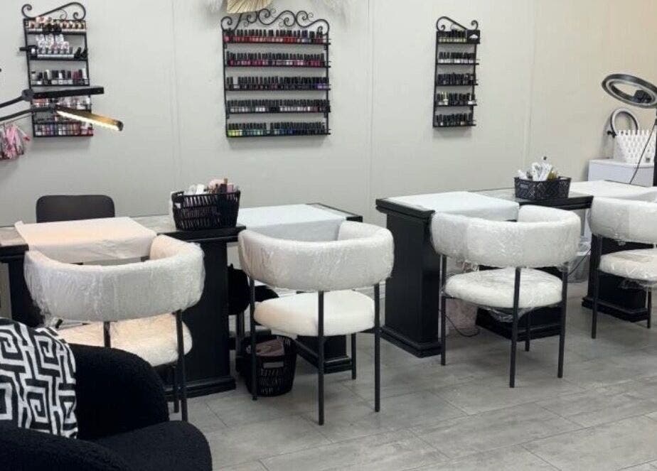 Nail salon at Tranquil, Liverpool, England, GB with elegant manicure stations and plush seating.