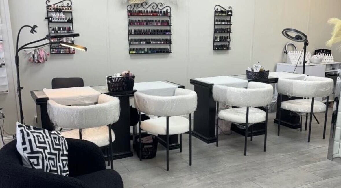 Nail salon at Tranquil, Liverpool, England, GB with elegant manicure stations and plush seating.