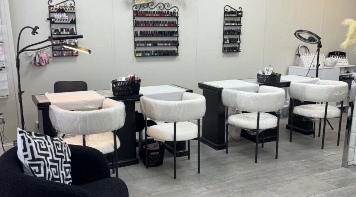 Nail salon at Tranquil, Liverpool, England, GB with elegant manicure stations and plush seating.