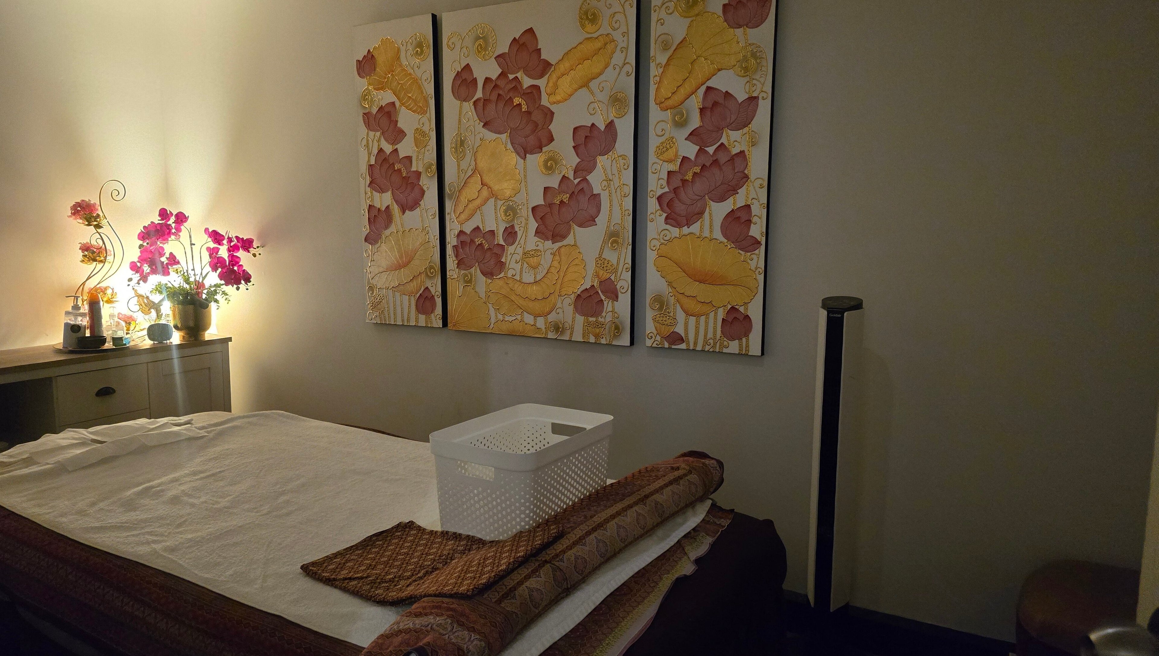 Relaxing massage room with floral art and ambient lighting at Royal Paradise Thai Massage and Remedial, Milton, Queensland, AU.