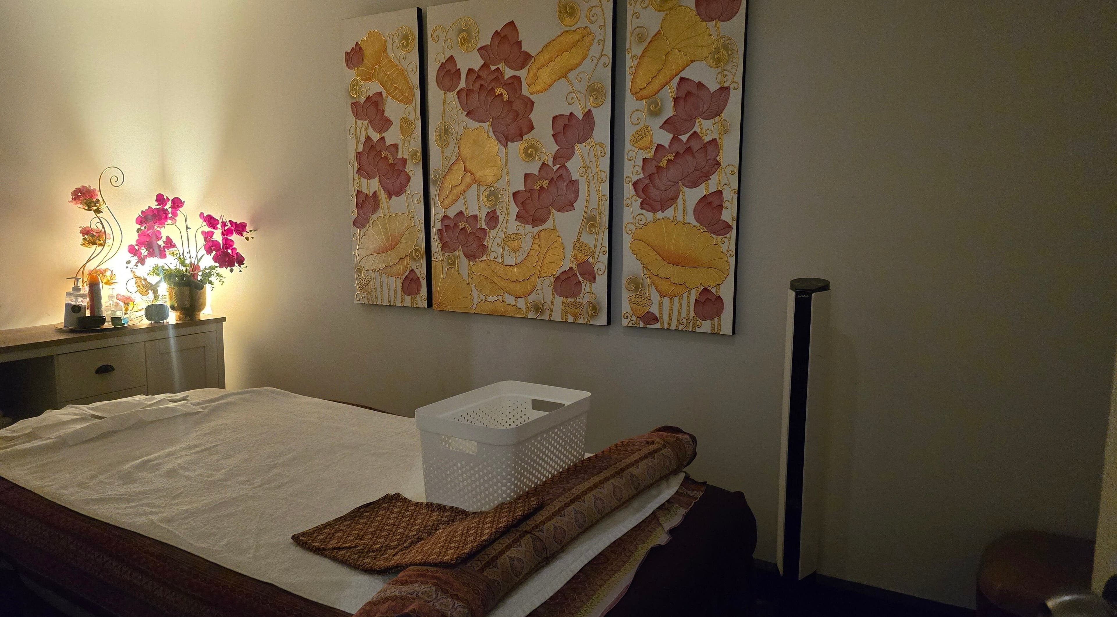 Relaxing massage room with floral art and ambient lighting at Royal Paradise Thai Massage and Remedial, Milton, Queensland, AU.