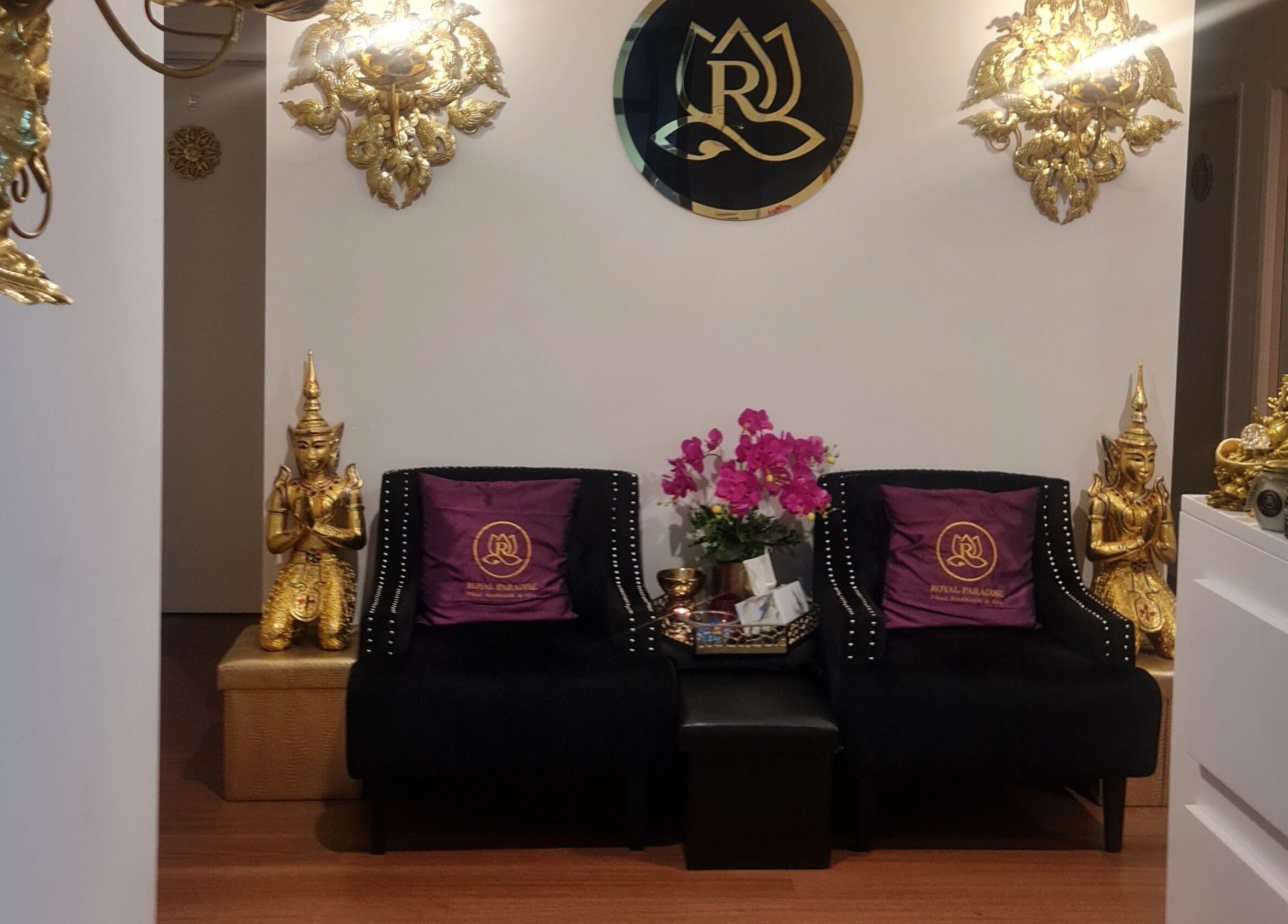 Royal Paradise Thai Massage and Remedial, Milton, Queensland. Luxurious lobby decor with gold accents and plush seating.