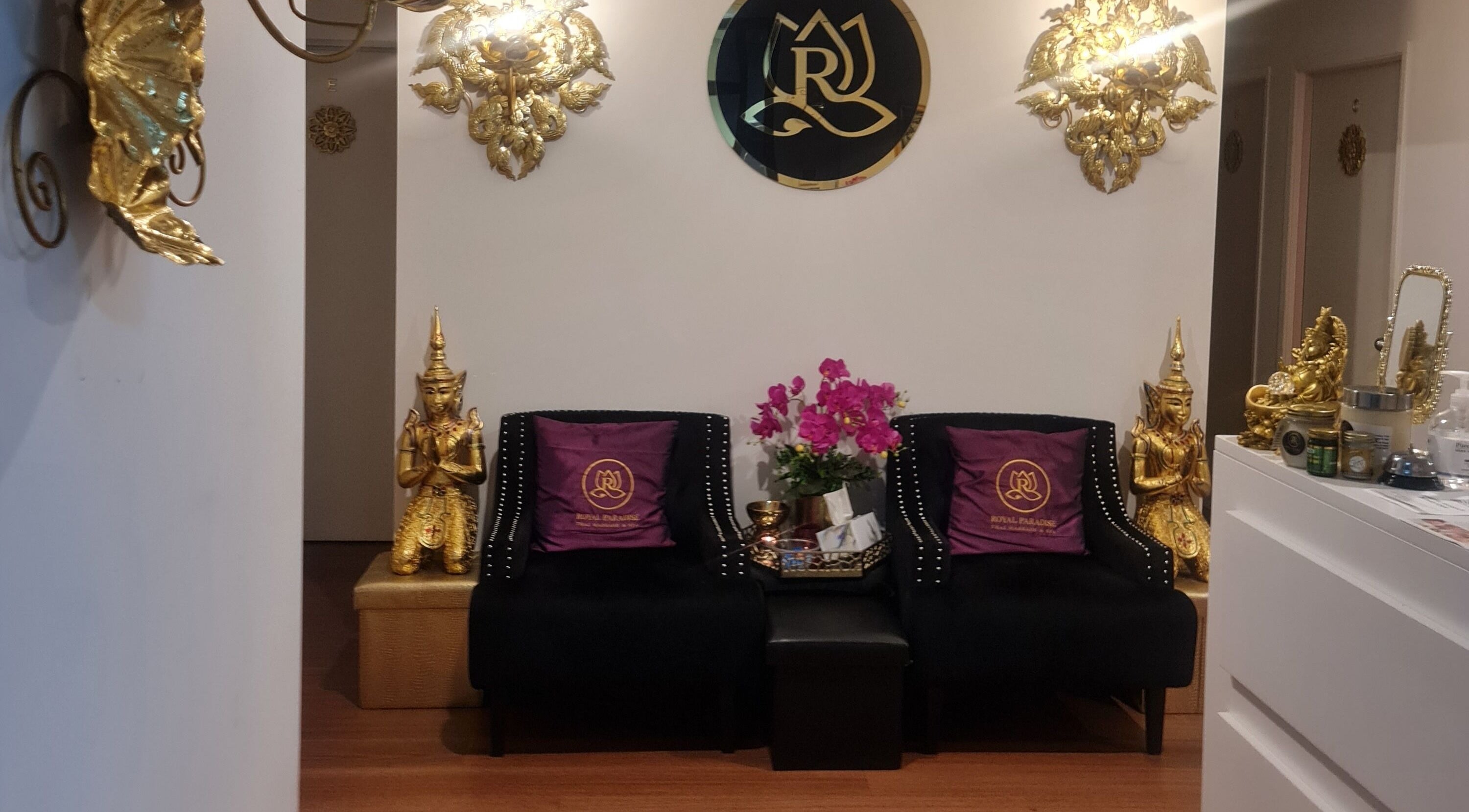 Royal Paradise Thai Massage and Remedial, Milton, Queensland. Luxurious lobby decor with gold accents and plush seating.