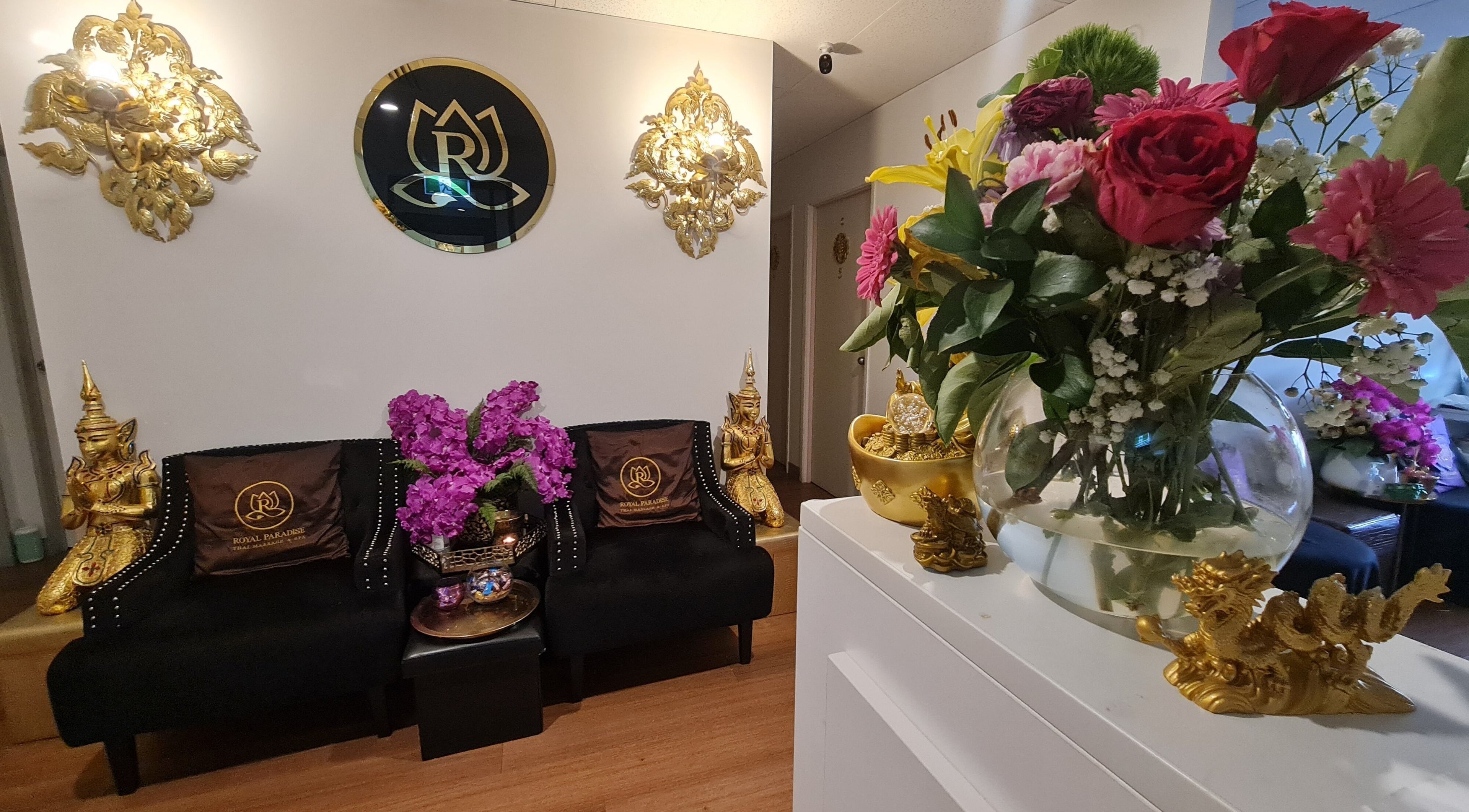 Elegant seating and floral decor inside Royal Paradise Thai Massage and Remedial, Milton, Queensland, AU.