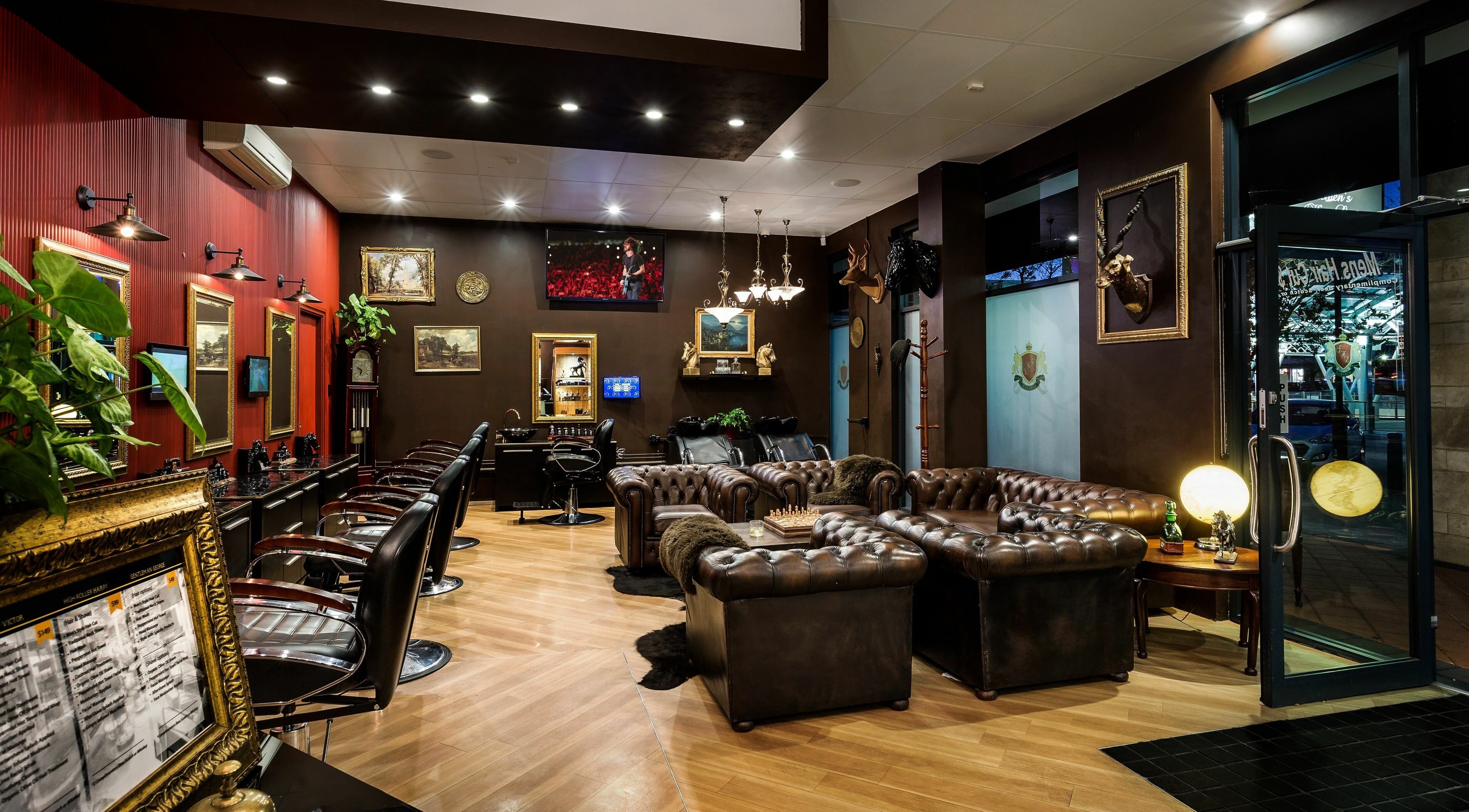 Elegant interior of Gentlemen's Hair Lounge, Subiaco, Western Australia, AU with leather chairs and vintage decor.
