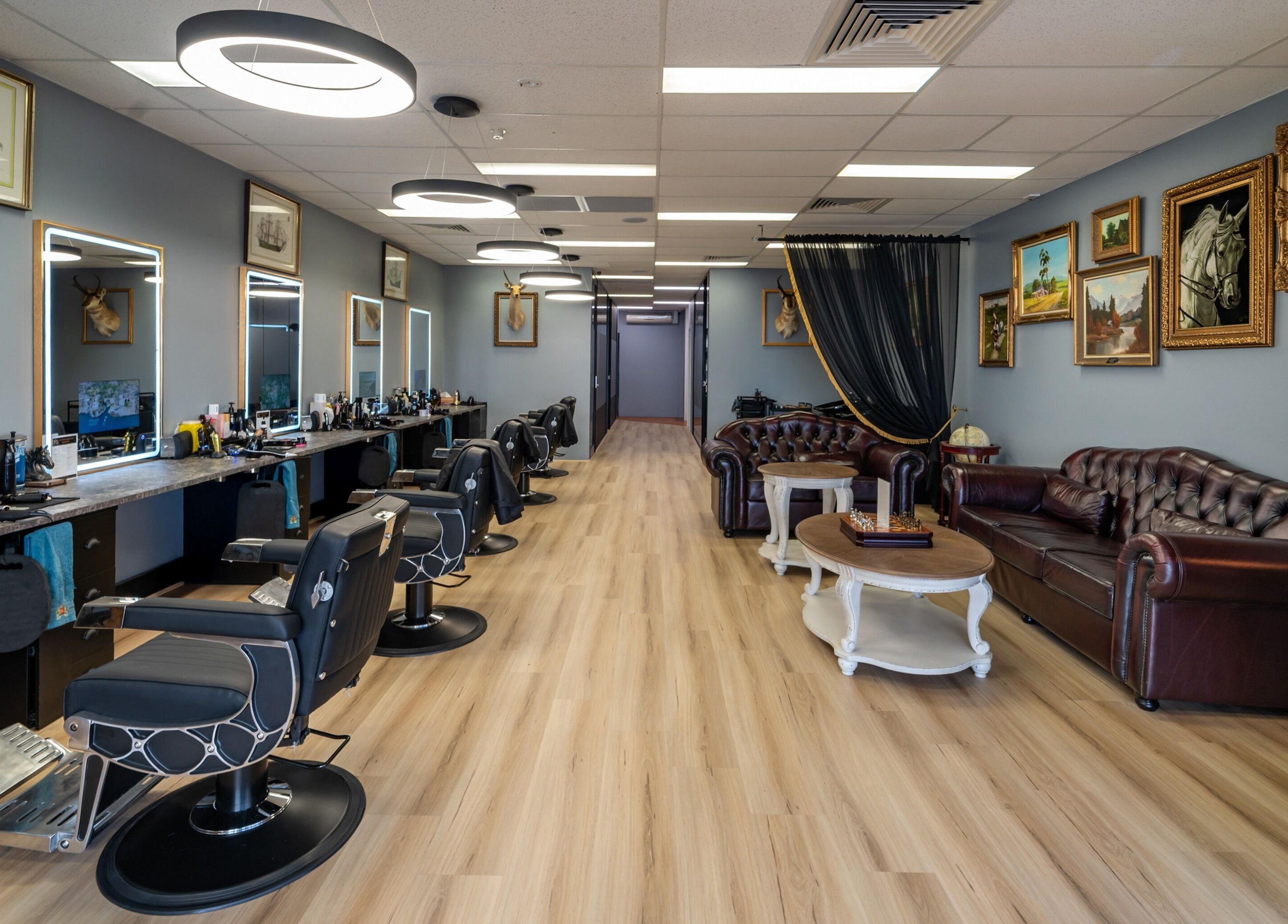 Gentlemen's Hair Lounge (Joondalup Branch) in Joondalup, WA features elegant decor and modern barber chairs.