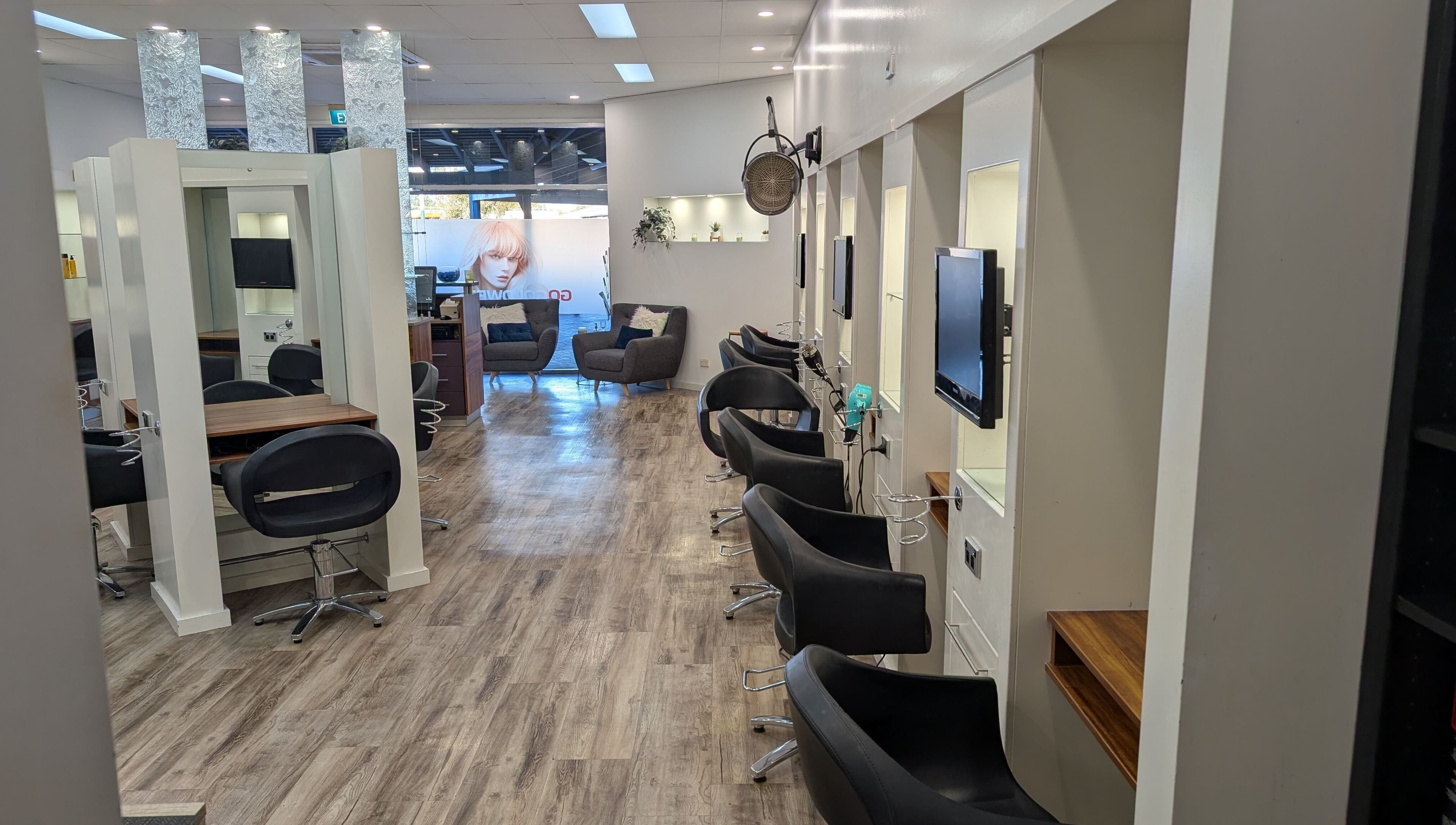 Elegant interior of FIG salon in Bull Creek, Western Australia, AU with sleek black chairs and modern decor.