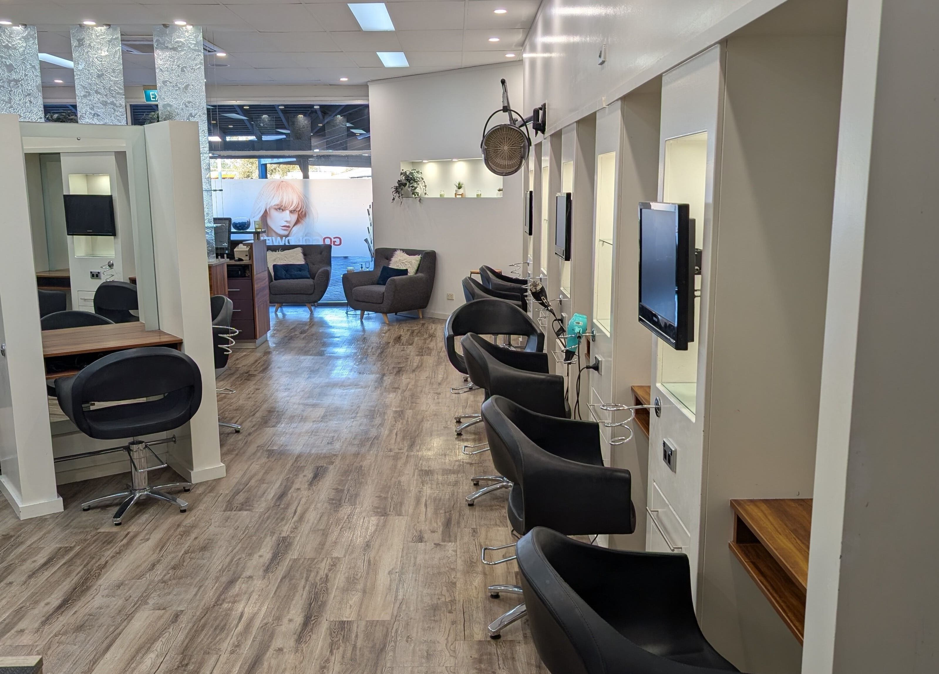 Elegant interior of FIG salon in Bull Creek, Western Australia, AU with sleek black chairs and modern decor.