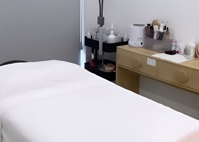 Relaxing treatment room at Simply Skin and Beauty, Alkimos, Western Australia, AU with spa bed and products.