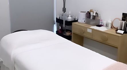 Relaxing treatment room at Simply Skin and Beauty, Alkimos, Western Australia, AU with spa bed and products.
