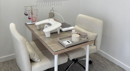 Manicure station at Cnorth Beauty, Wishaw, Scotland, GB featuring elegant tools and seating.