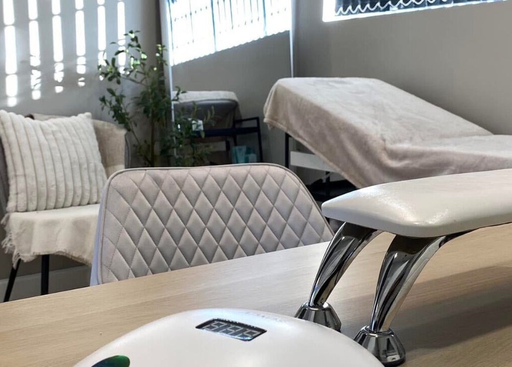 Elegant nail treatment room at Nails by Erika, Morley, England, GB with plush seating and modern decor.