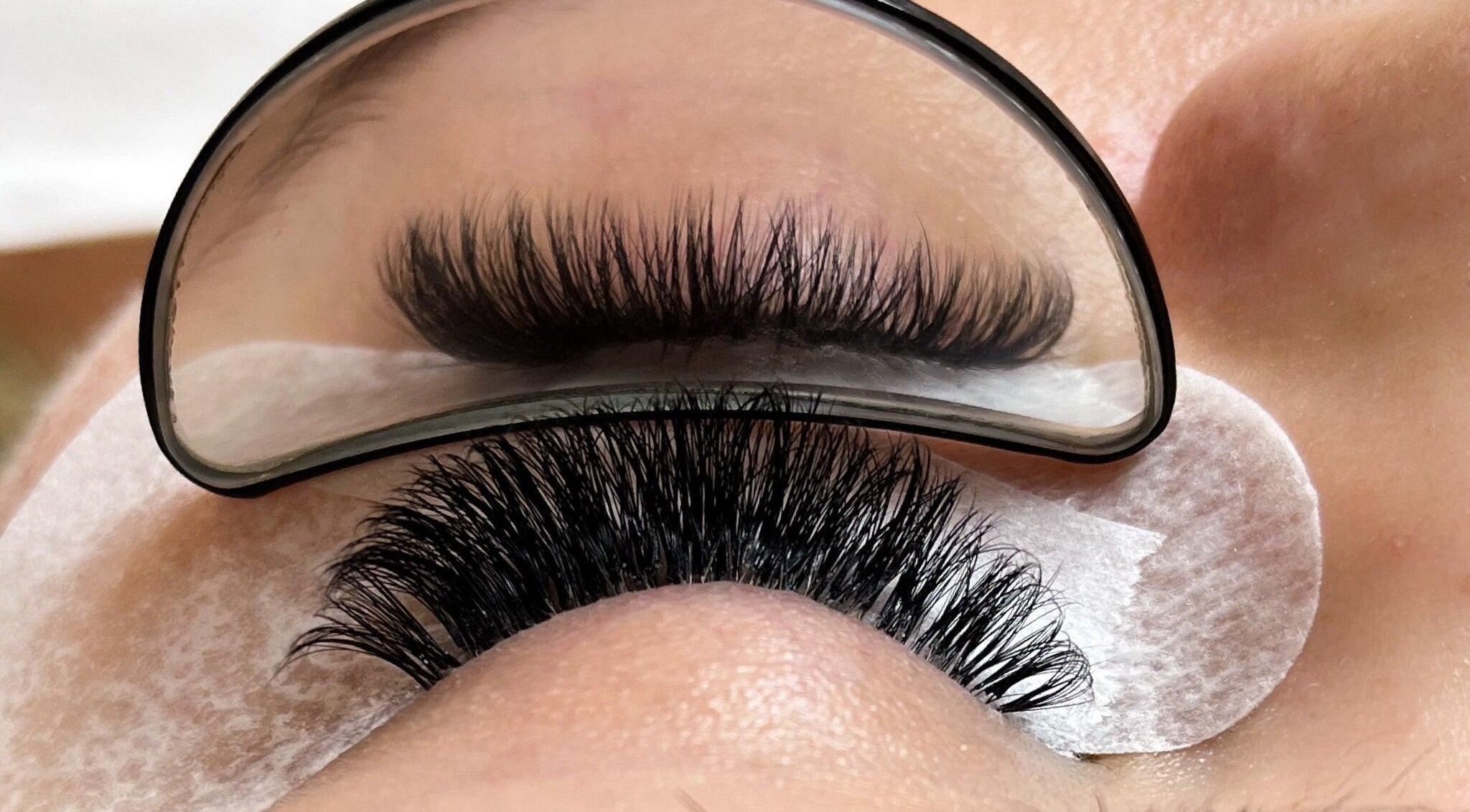 Close-up of expert eyelash extension at Nova Beauty Studio, Cape Town, Western Cape, ZA.