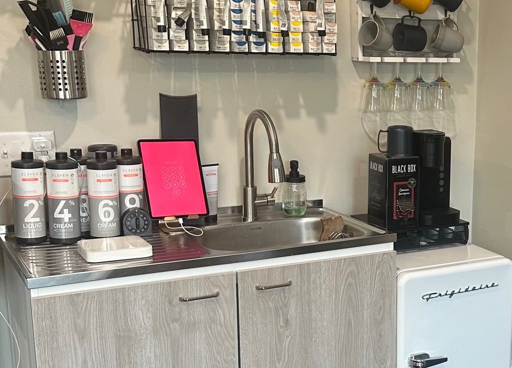 Chic workspace with hair products and sink at Sacro Studio, LLC, Bethlehem, Pennsylvania, US.