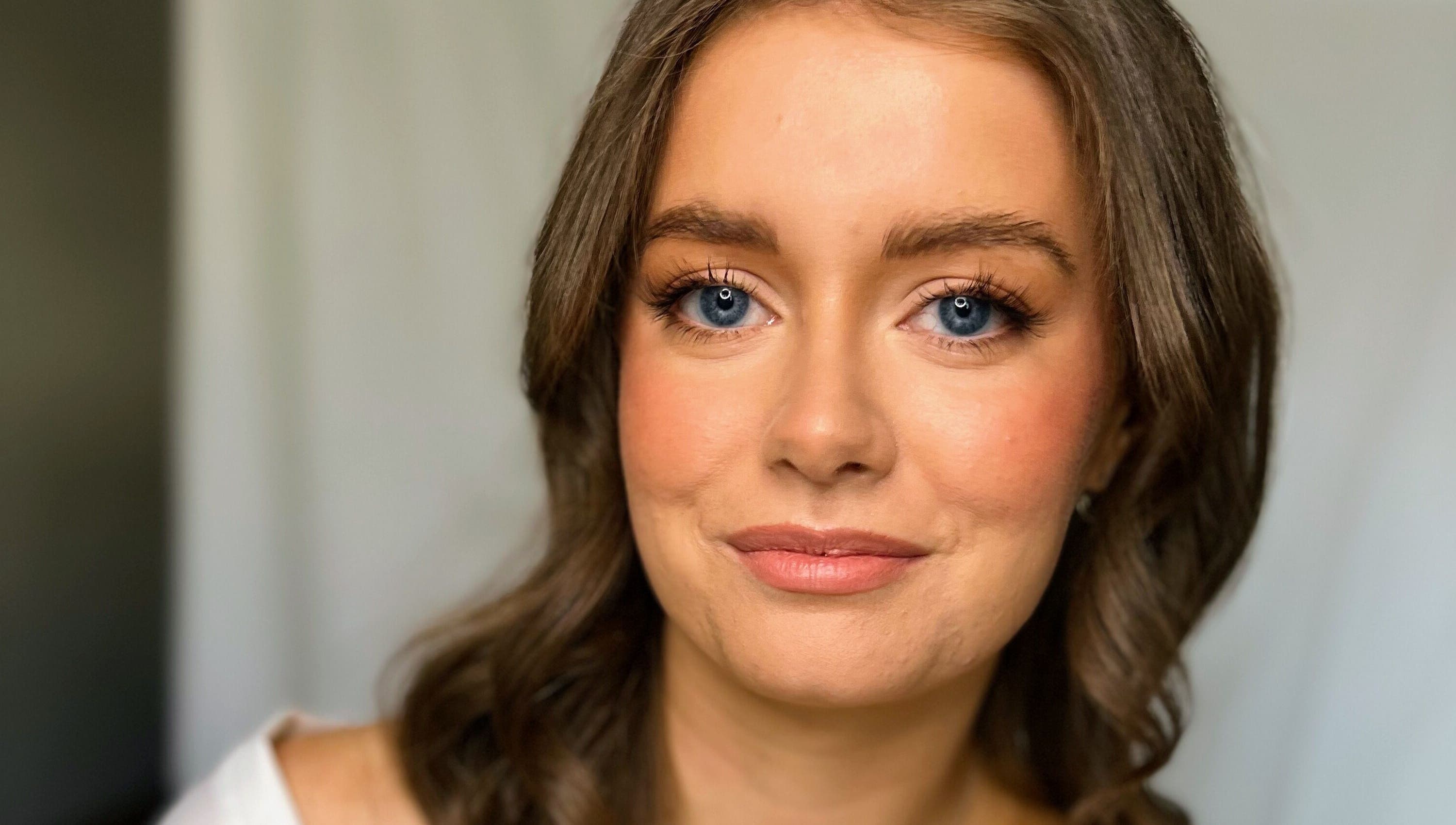 Smiling woman at Andrea Maxwell Artemisia Hair & Beauty Studio, Cawdor, Scotland, GB. Natural beauty and elegance.