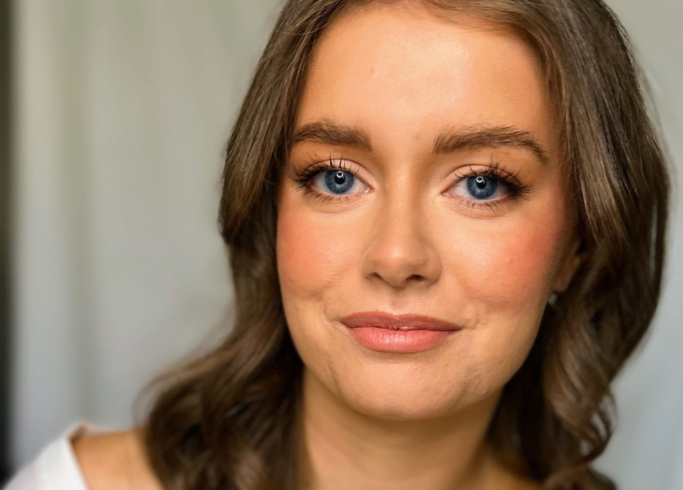 Smiling woman at Andrea Maxwell Artemisia Hair & Beauty Studio, Cawdor, Scotland, GB. Natural beauty and elegance.