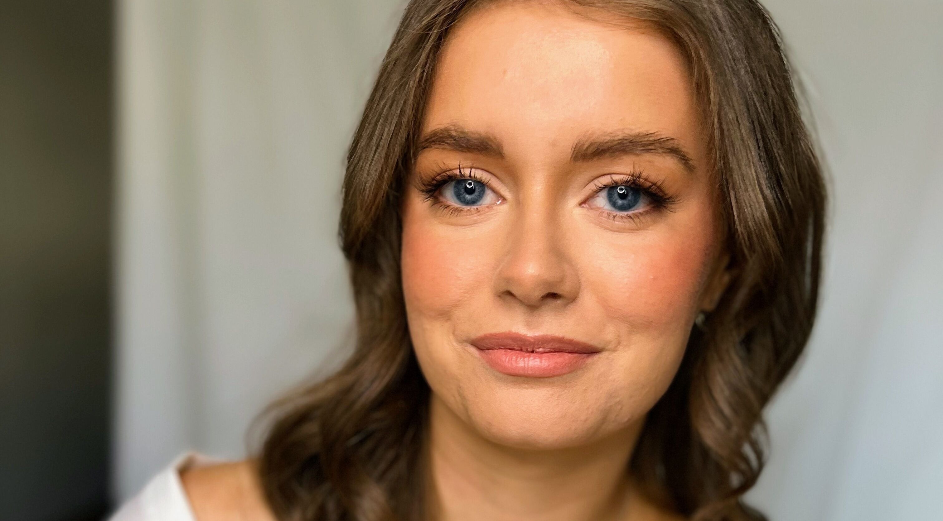Smiling woman at Andrea Maxwell Artemisia Hair & Beauty Studio, Cawdor, Scotland, GB. Natural beauty and elegance.