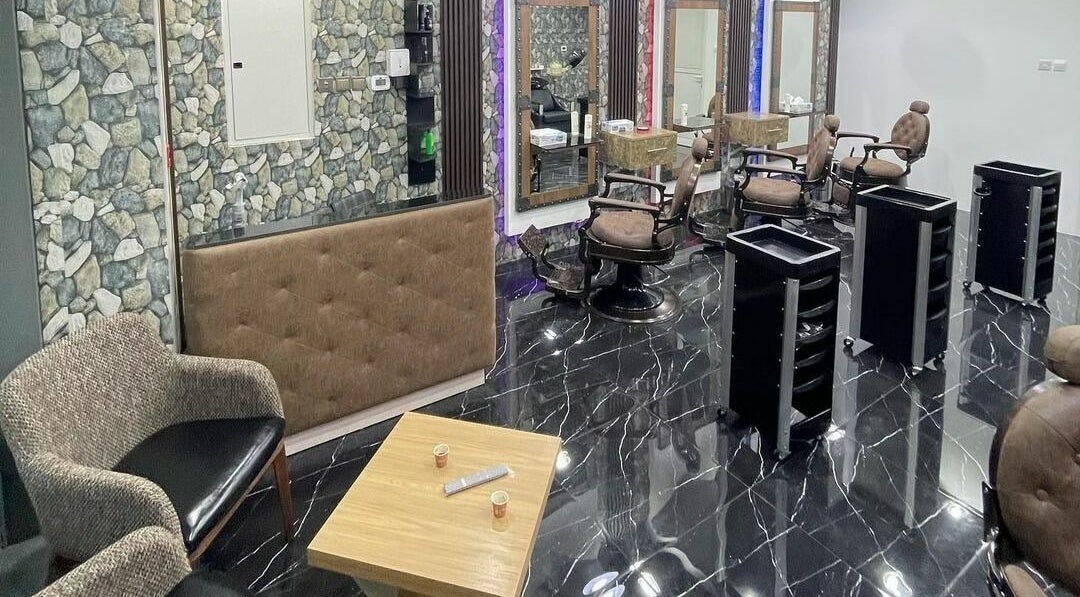 Stylish interior of Dimassi Gents Salon in Dubai, AE, featuring modern chairs and elegant decor.