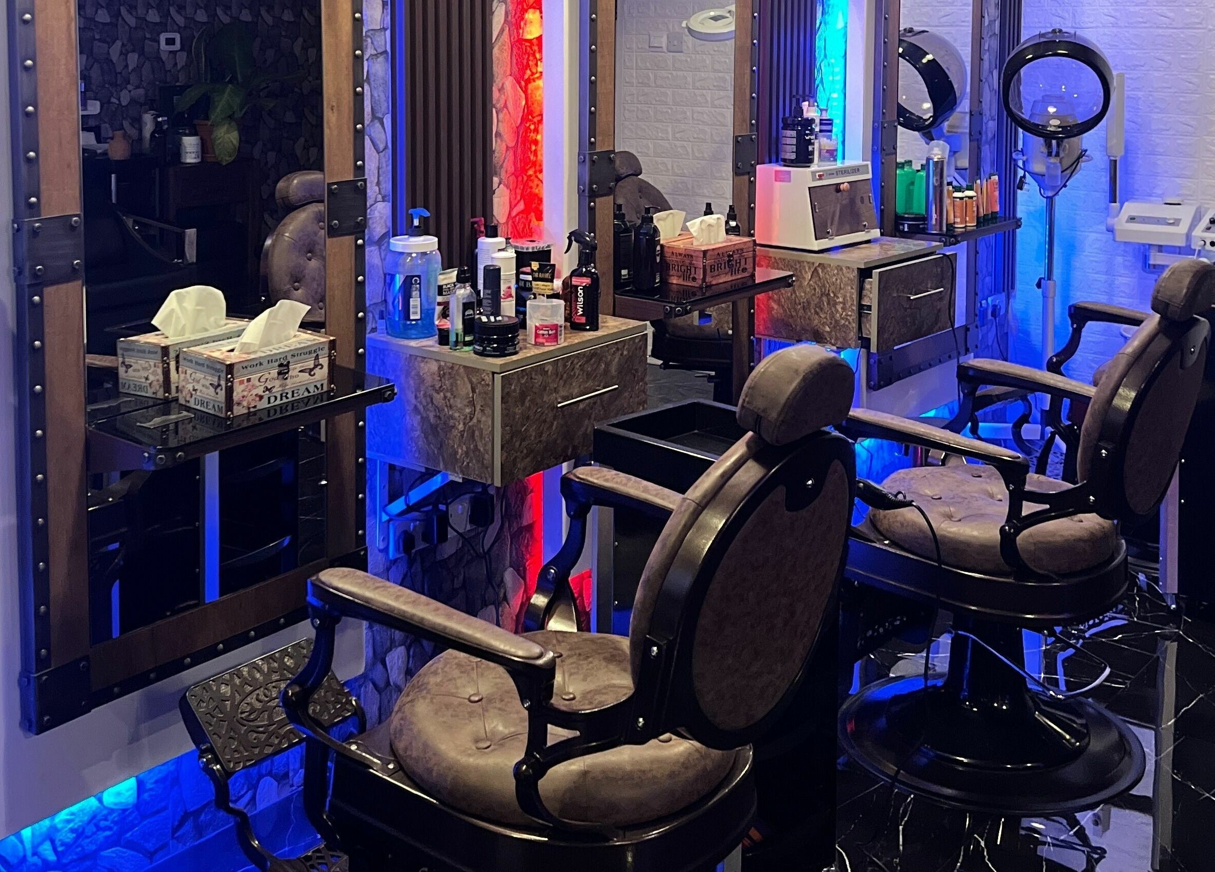 Interior of Dimassi Gents Salon in Dubai, AE, showcasing plush barber chairs and sleek grooming stations.