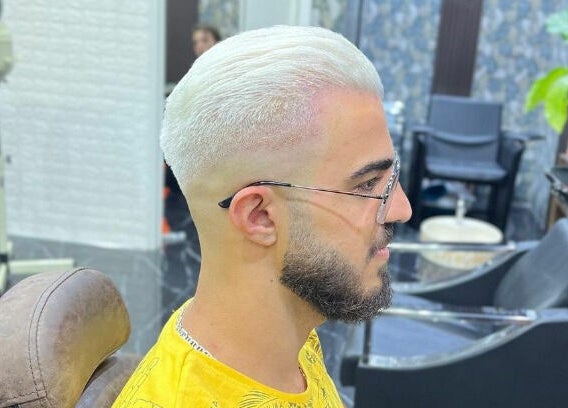 Stylish male haircut at Dimassi Gents Salon, Dubai, AE showcasing modern grooming.