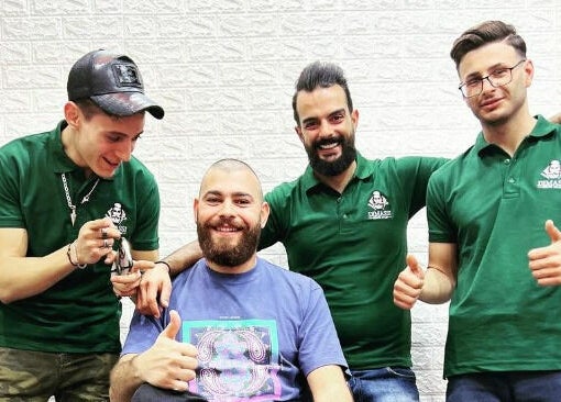 Friendly team at Dimassi Gents Salon, Dubai, AE, offering quality grooming services with enthusiasm.
