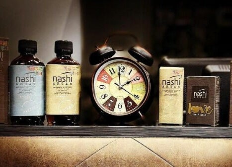 Nashi Argan products displayed at Dimassi Gents Salon in Dubai, AE, showcasing luxury haircare items.