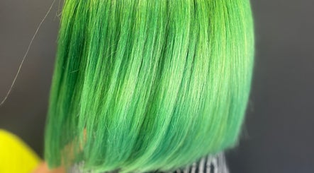 Vibrant green hair at Elite Luster by Mandie, San Antonio, Texas, US. A stunning, bold hairstyle choice.