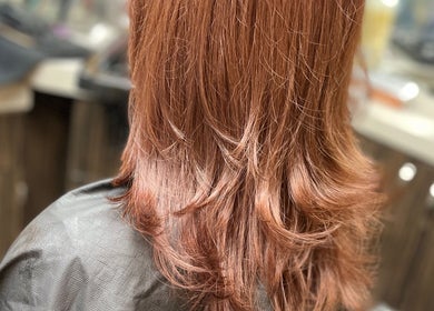 Elegant copper-toned hairstyle at Elite Luster by Mandie, San Antonio, Texas, US.