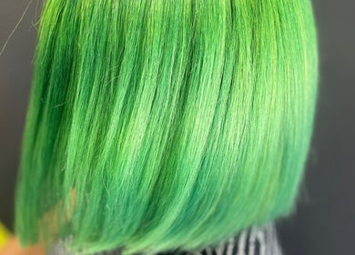 Vibrant green hair dye at Elite Luster by Mandie in San Antonio, Texas, US, showcasing a sleek finish.