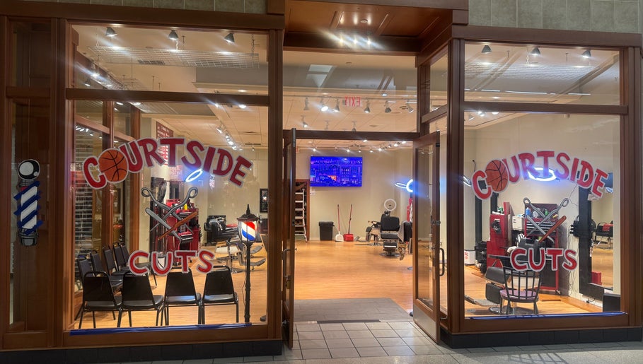 Courtside Cuts by Sen Boone🔥 salon entrance, Saginaw, Michigan, US, showcasing stylish barber chairs and decor.