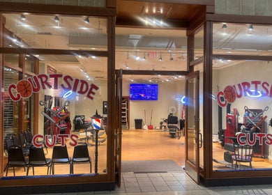 Courtside Cuts by Sen Boone🔥 salon entrance, Saginaw, Michigan, US, showcasing stylish barber chairs and decor.