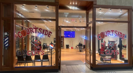 Courtside Cuts by Sen Boone🔥 salon entrance, Saginaw, Michigan, US, showcasing stylish barber chairs and decor.