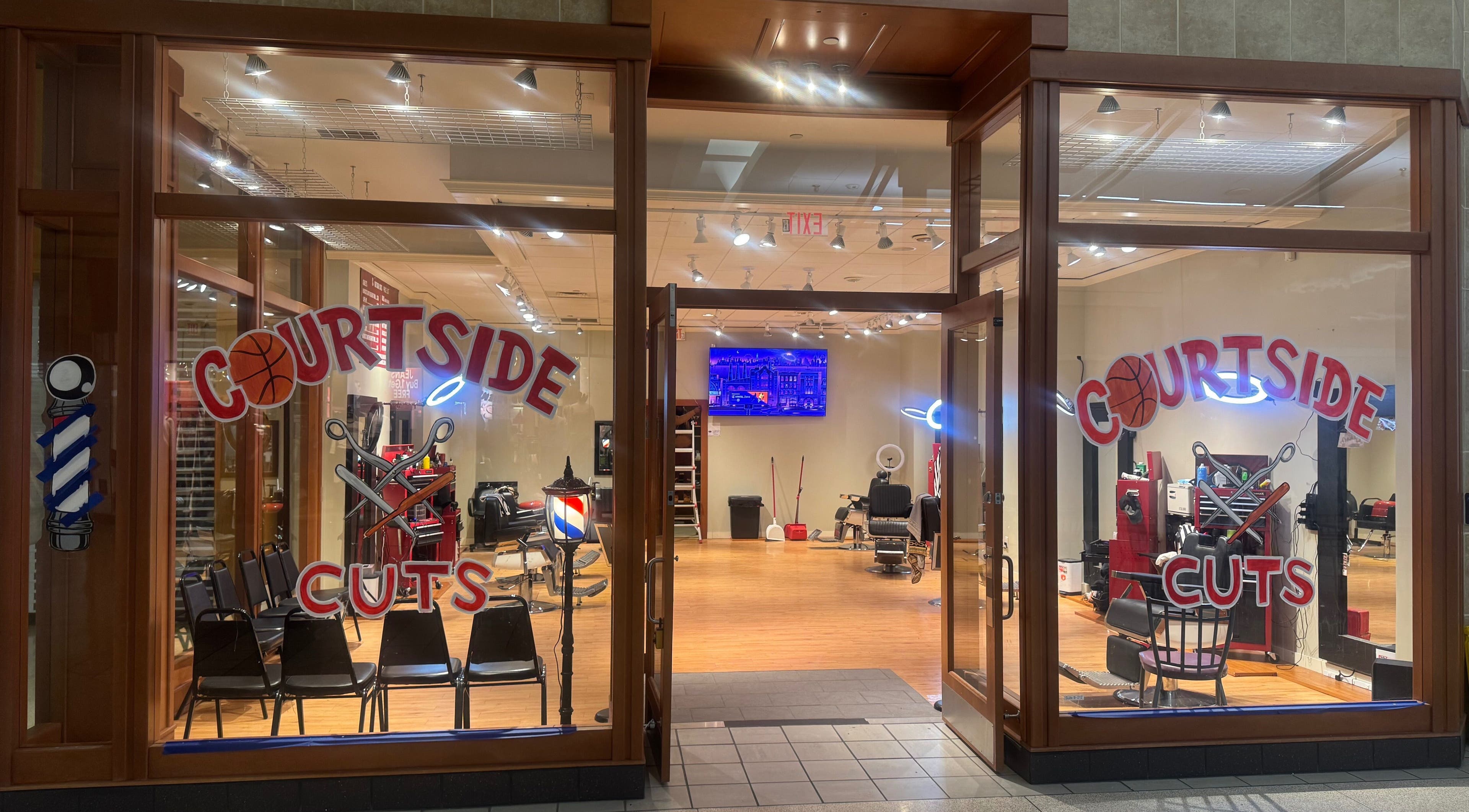 Courtside Cuts by Sen Boone🔥 salon entrance, Saginaw, Michigan, US, showcasing stylish barber chairs and decor.