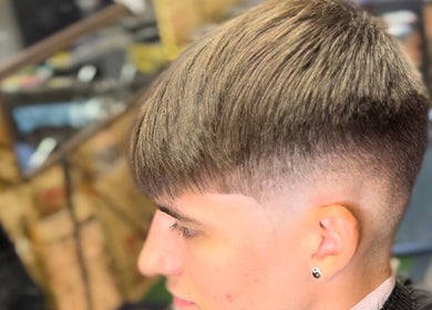 Close-up of a crisp fade cut at Courtside Cuts by Sen Boone🔥, Saginaw, Michigan, US.