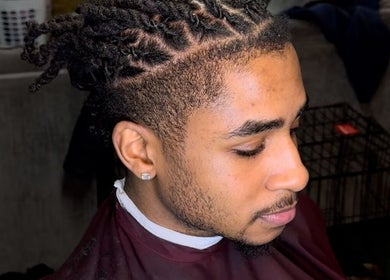 Stylish twist hairstyle at Courtside Cuts by Sen Boone🔥 in Saginaw, Michigan, US - top view.