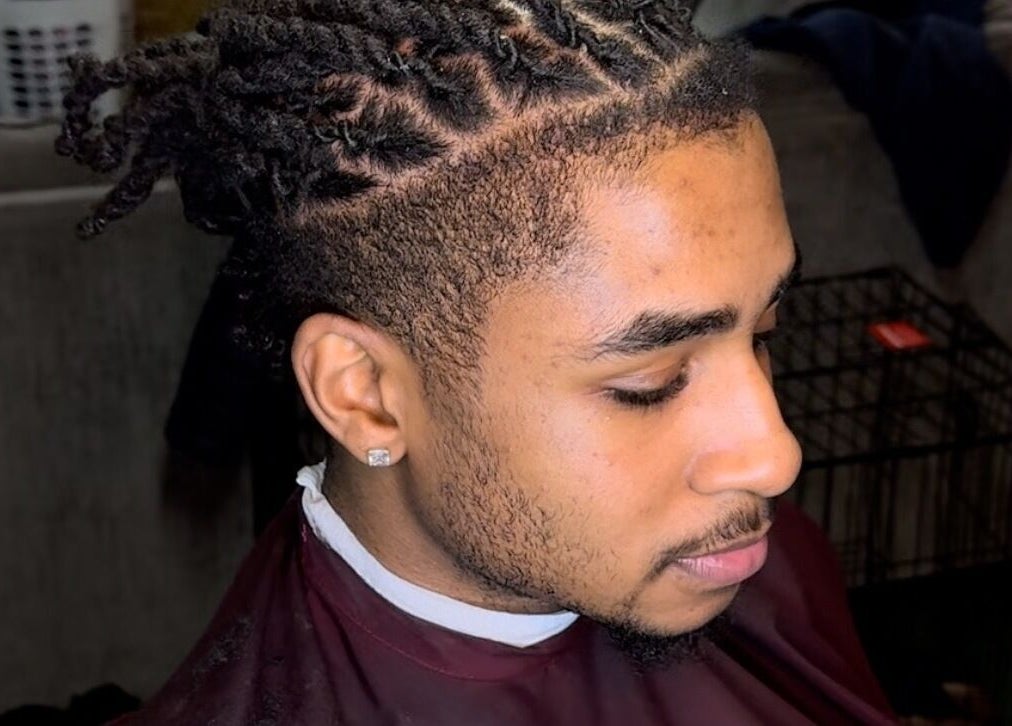 Stylish twist hairstyle at Courtside Cuts by Sen Boone🔥 in Saginaw, Michigan, US - top view.