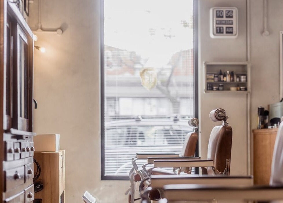 Classic leather chairs inside P&P Barbers — PPHH Store in Melbourne, Victoria, AU. Inviting vintage ambiance.
