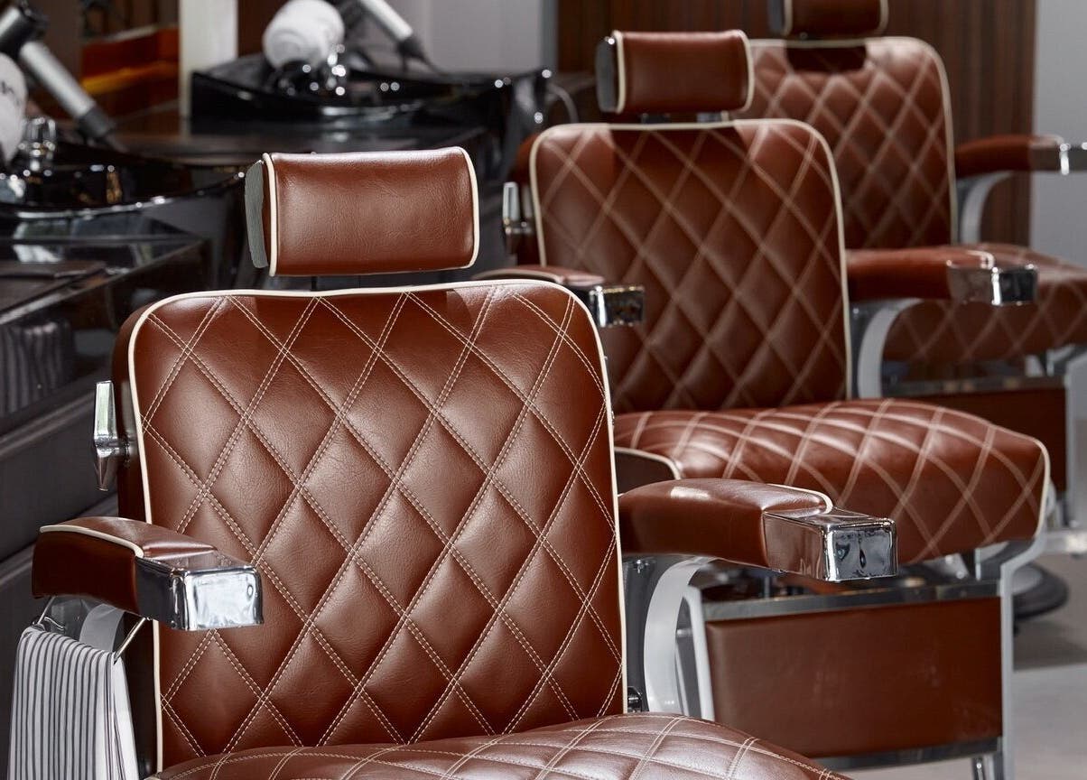 Luxurious barber chairs at House of Cuts - Media City, Dubai, Dubai, AE exuding comfort and style.