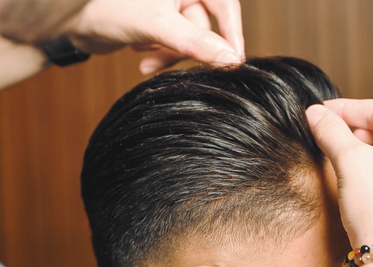 Expert hairstyling at House of Cuts - Media City, Dubai, Dubai, AE for a polished look.