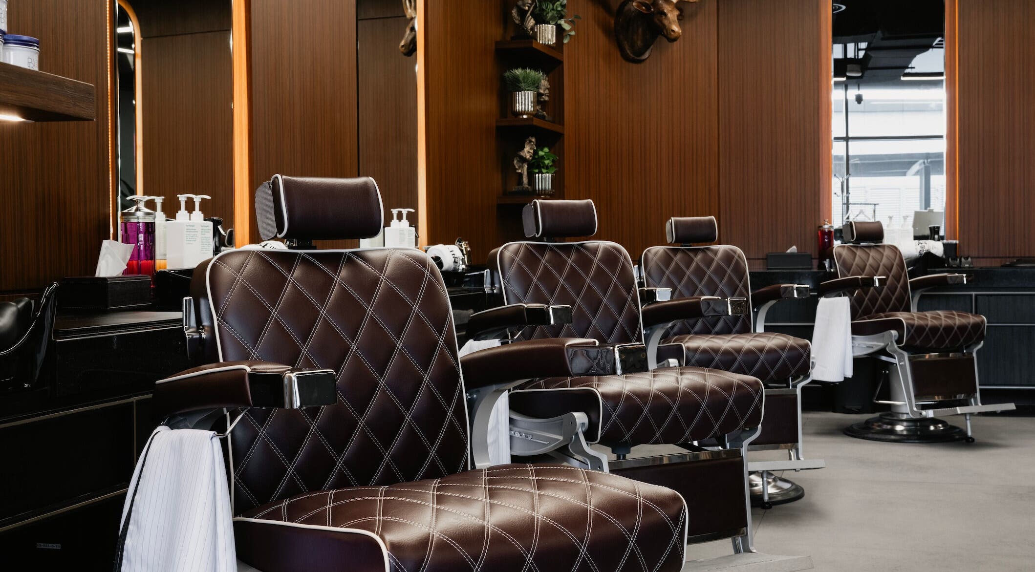 Luxurious barber chairs at House of Cuts - Business Bay, Dubai, Dubai, AE, reflecting a stylish ambiance.