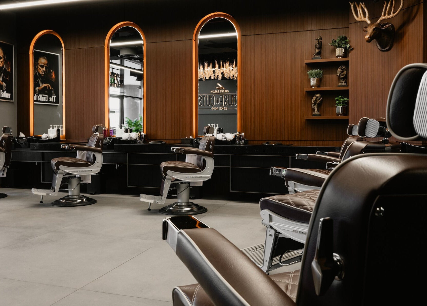 Elegant interior of House of Cuts - Business Bay, Dubai, Dubai, AE featuring plush barber chairs and luxurious decor.