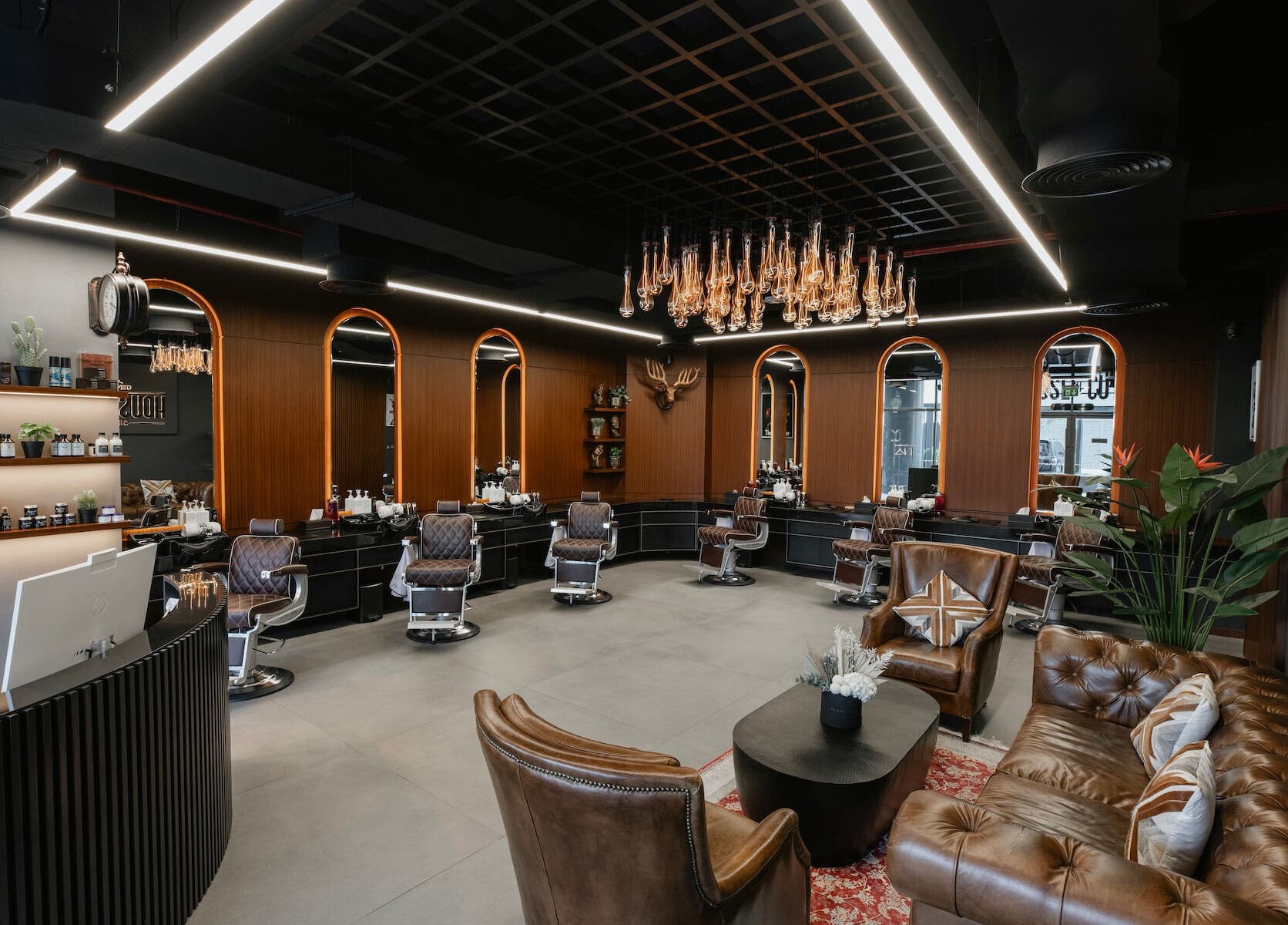 Elegant interior of House of Cuts - Business Bay salon in Dubai, Dubai, AE showcasing luxury barber chairs and decor.