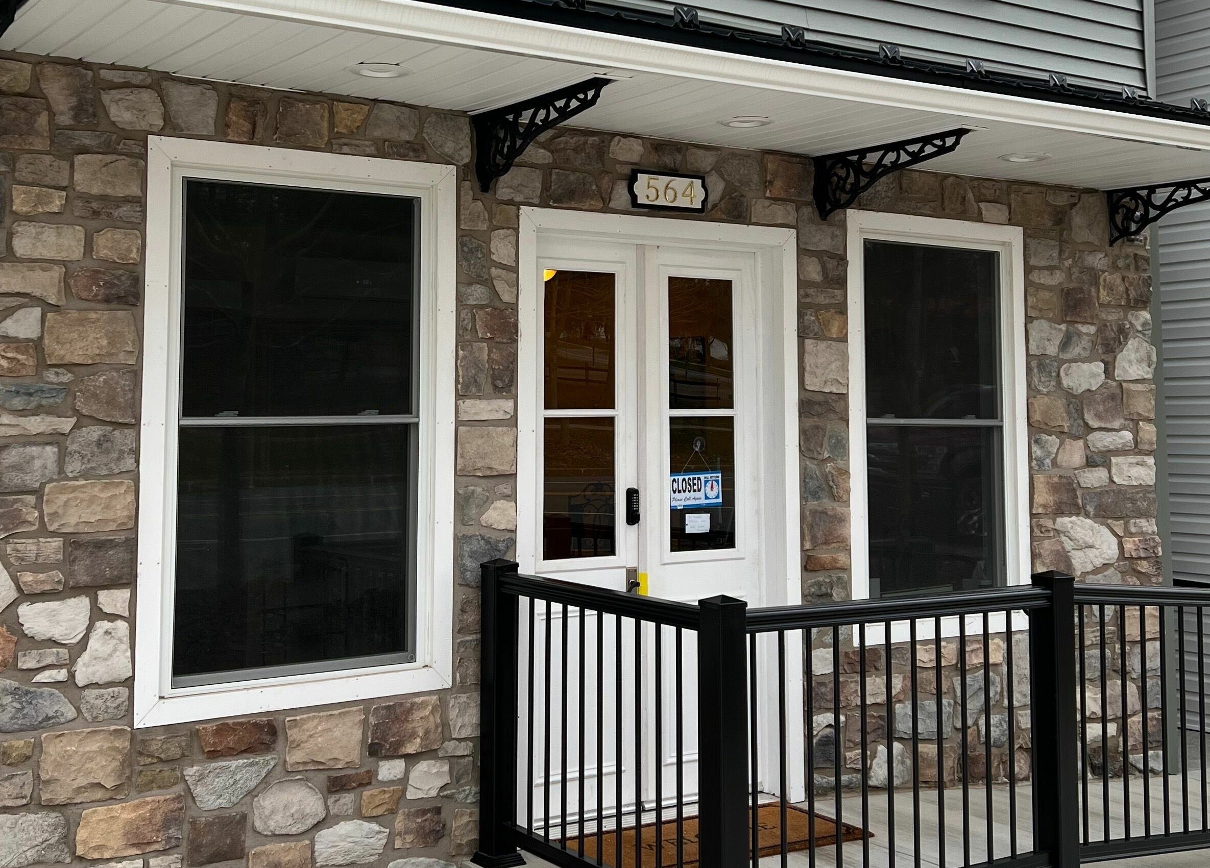 Charming stone facade entrance at Laporte’s Hidden Gem Day Spa, Laporte, Pennsylvania, US.