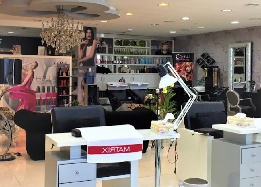 Interior view of Crystal Beauty Lounge in Dubai, AE, featuring stylish salon stations and decor.