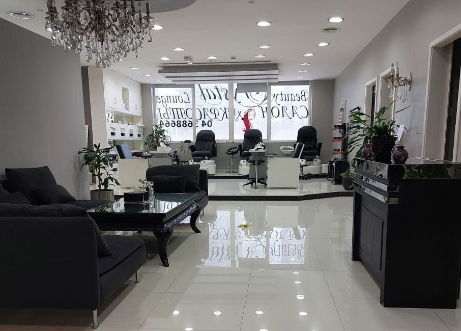 Sleek interior of Crystal Beauty Lounge in Dubai, AE, showcasing elegant seating and modern decor.